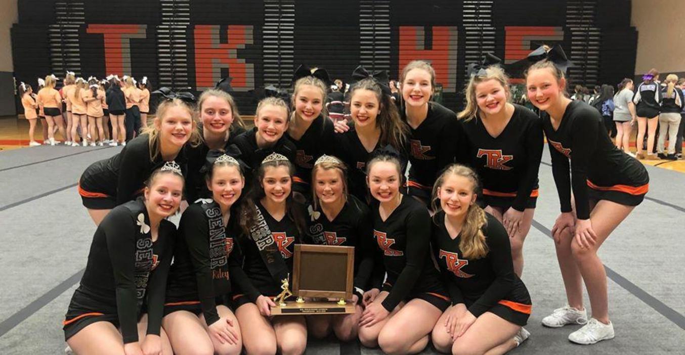 TKHS cheer team brings home a trophy.