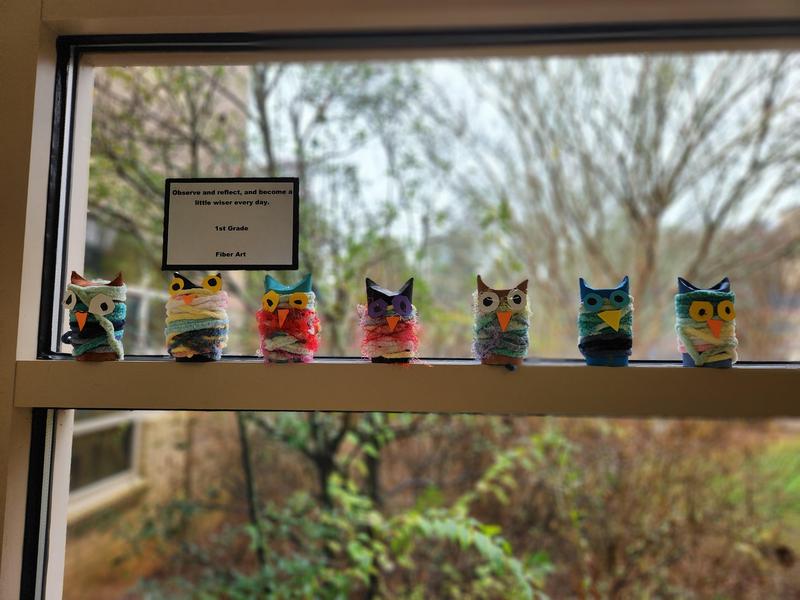 Yarn owls on display on the window