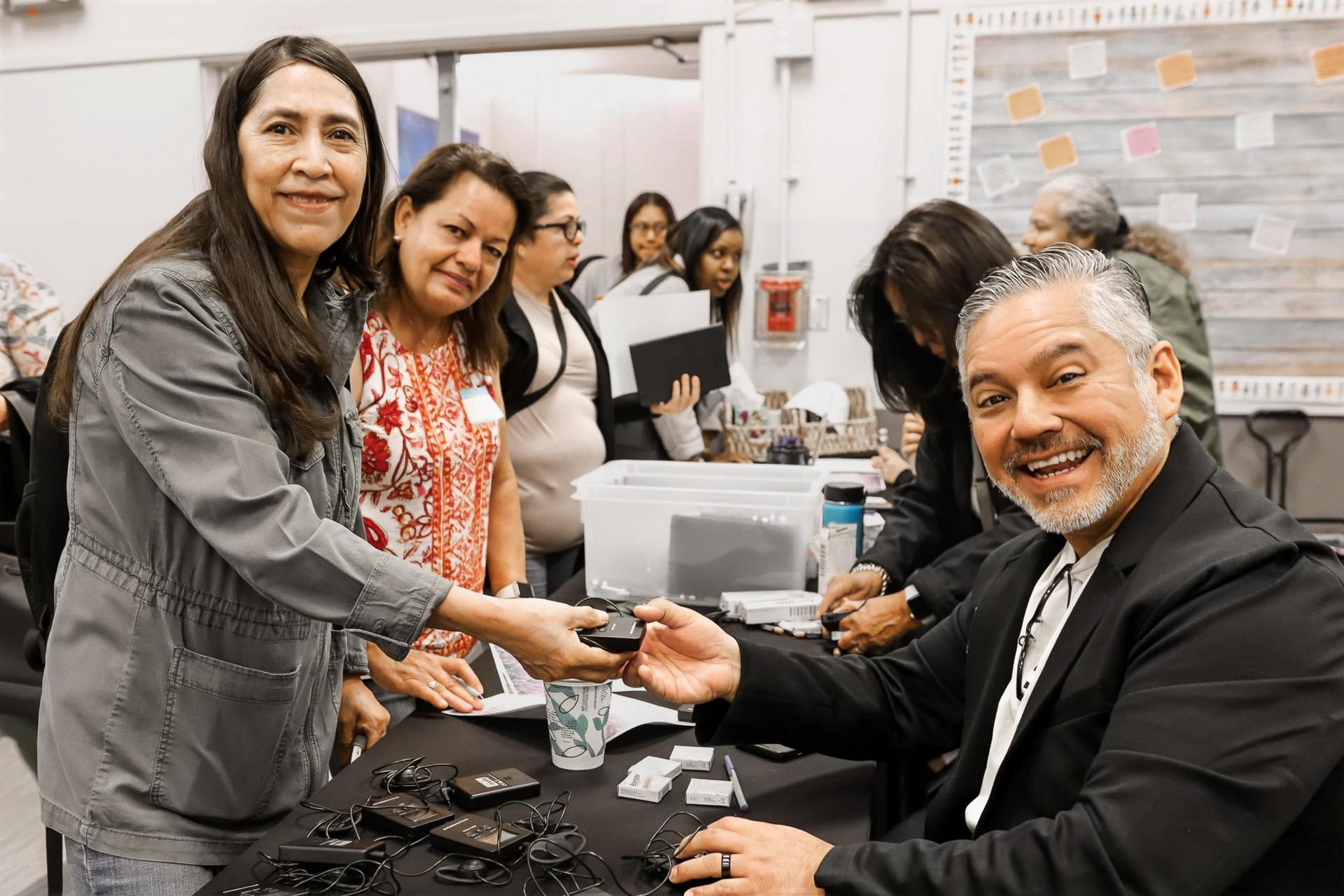 staff assisting attendee