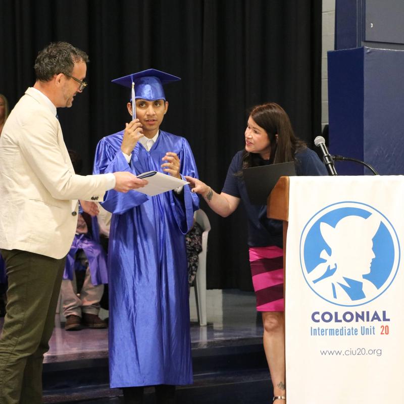 man and woman holding graduate a diploma