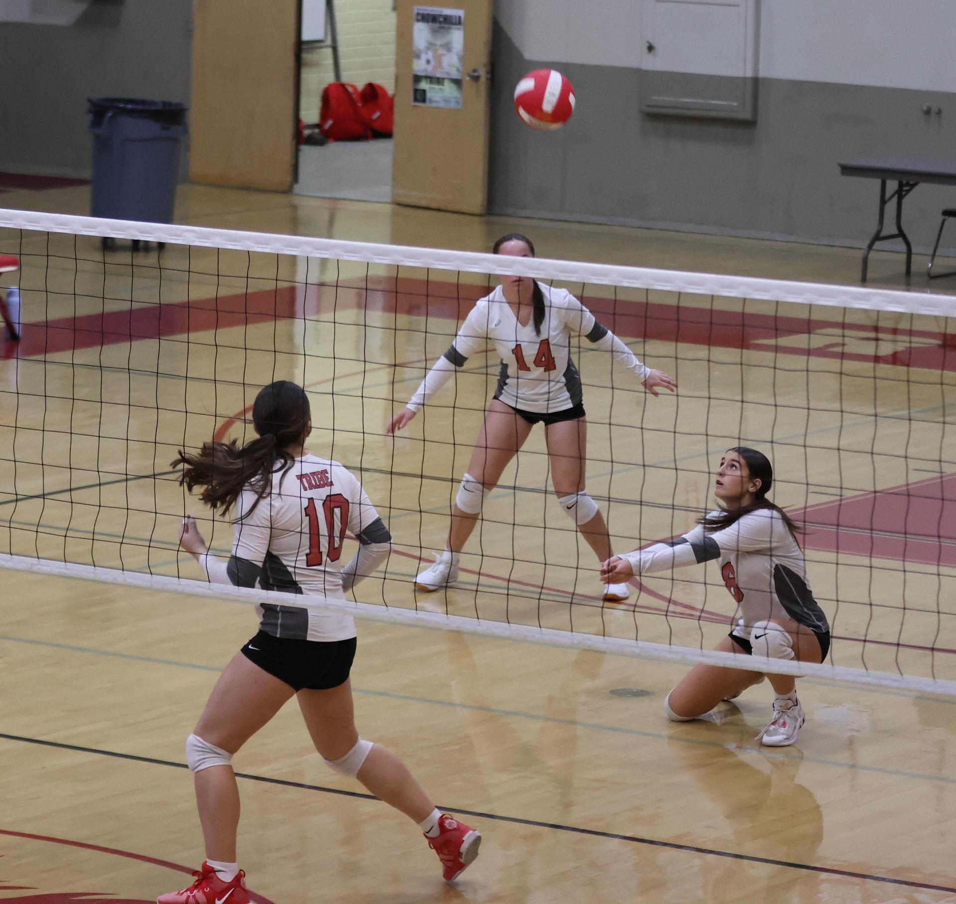 junior varsity girls playing volleyball 93