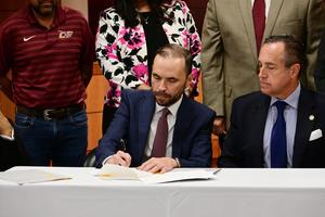 Superintendent signing