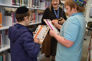 5B enrichment visits the library.
