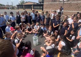 Students release butterflies as part of our SEEDS curriculum.