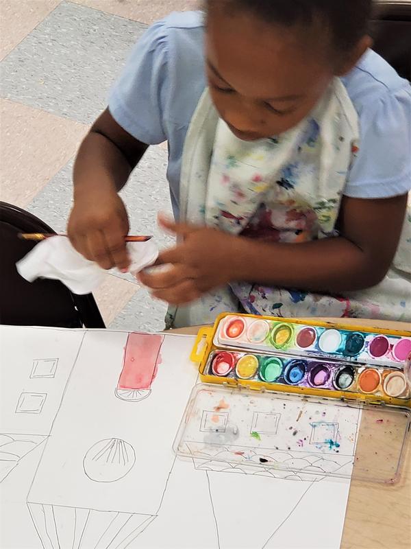 2nd grade art students working.