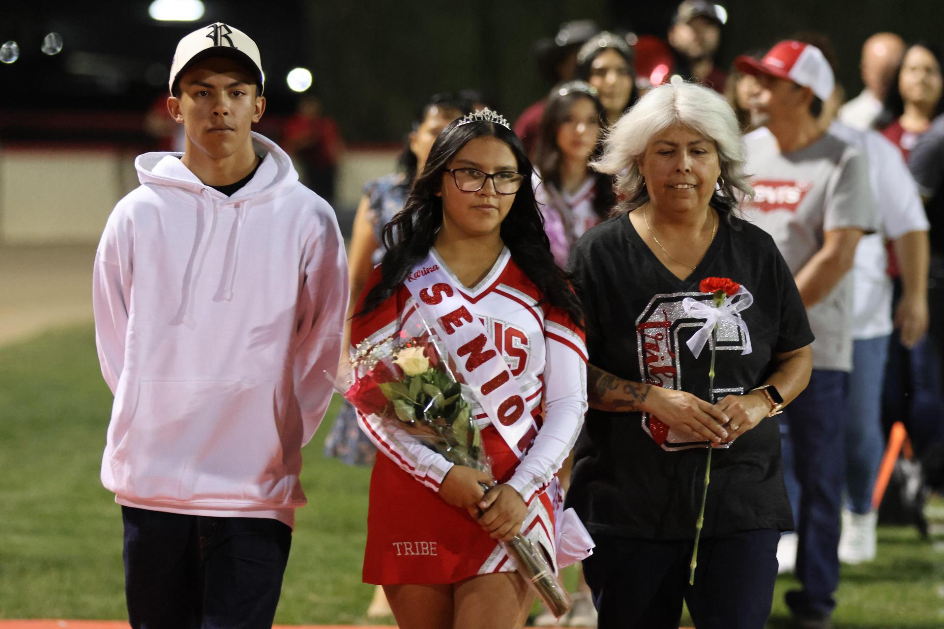 seniors and their escorts celebrating senior night