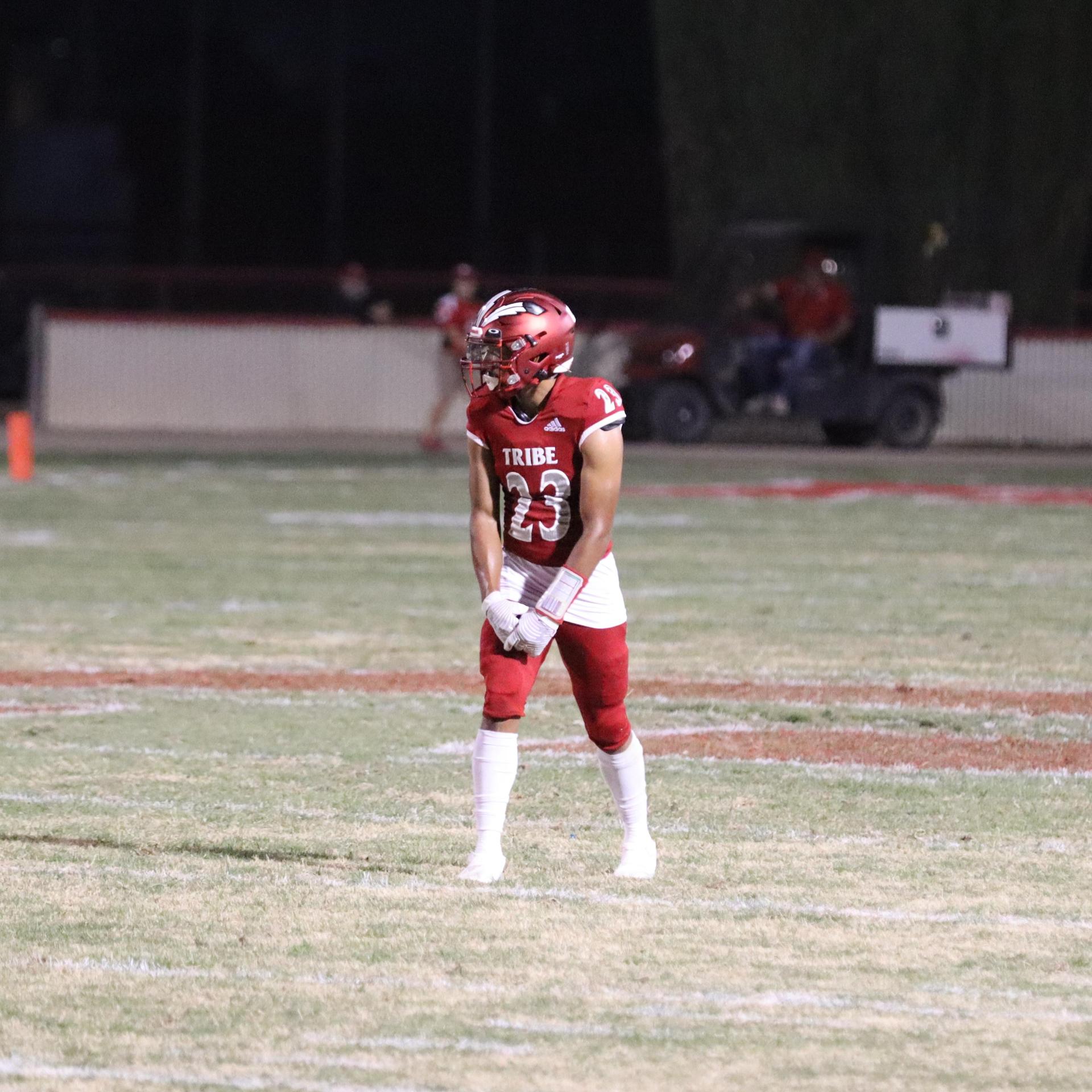 varsity football players in action against Riverdale