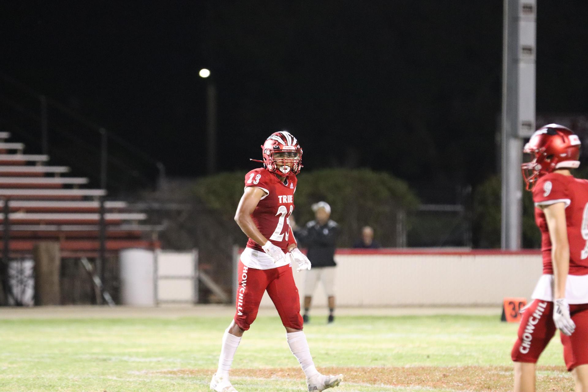 varsity football players in action against Riverdale