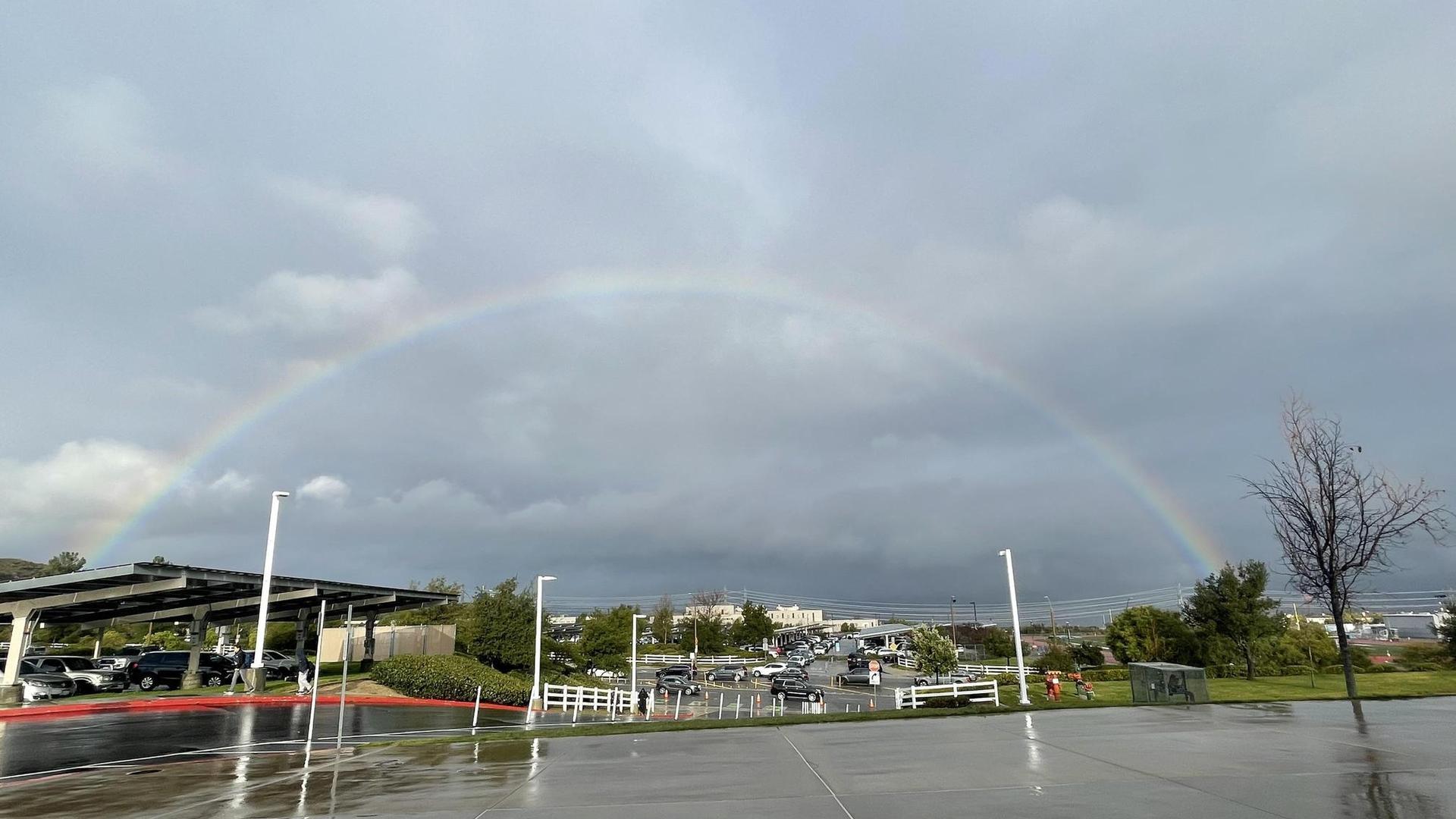 Rainbow overlooking school front facing the road