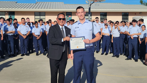 Air Force JROTC leader being presented with an award