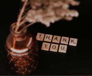 scrabble tiles spell out "Thank You"