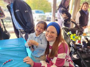 A student poses with her mother.