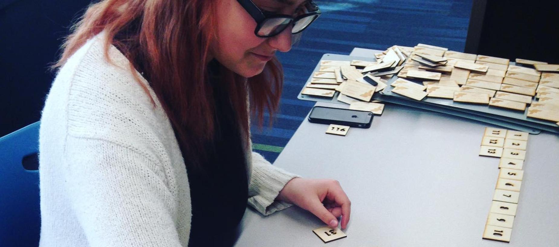 Student with laser cut numbers