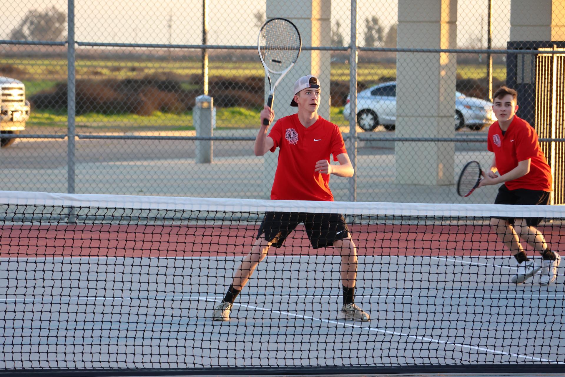 CUHS Boys playing tennis against coalinga