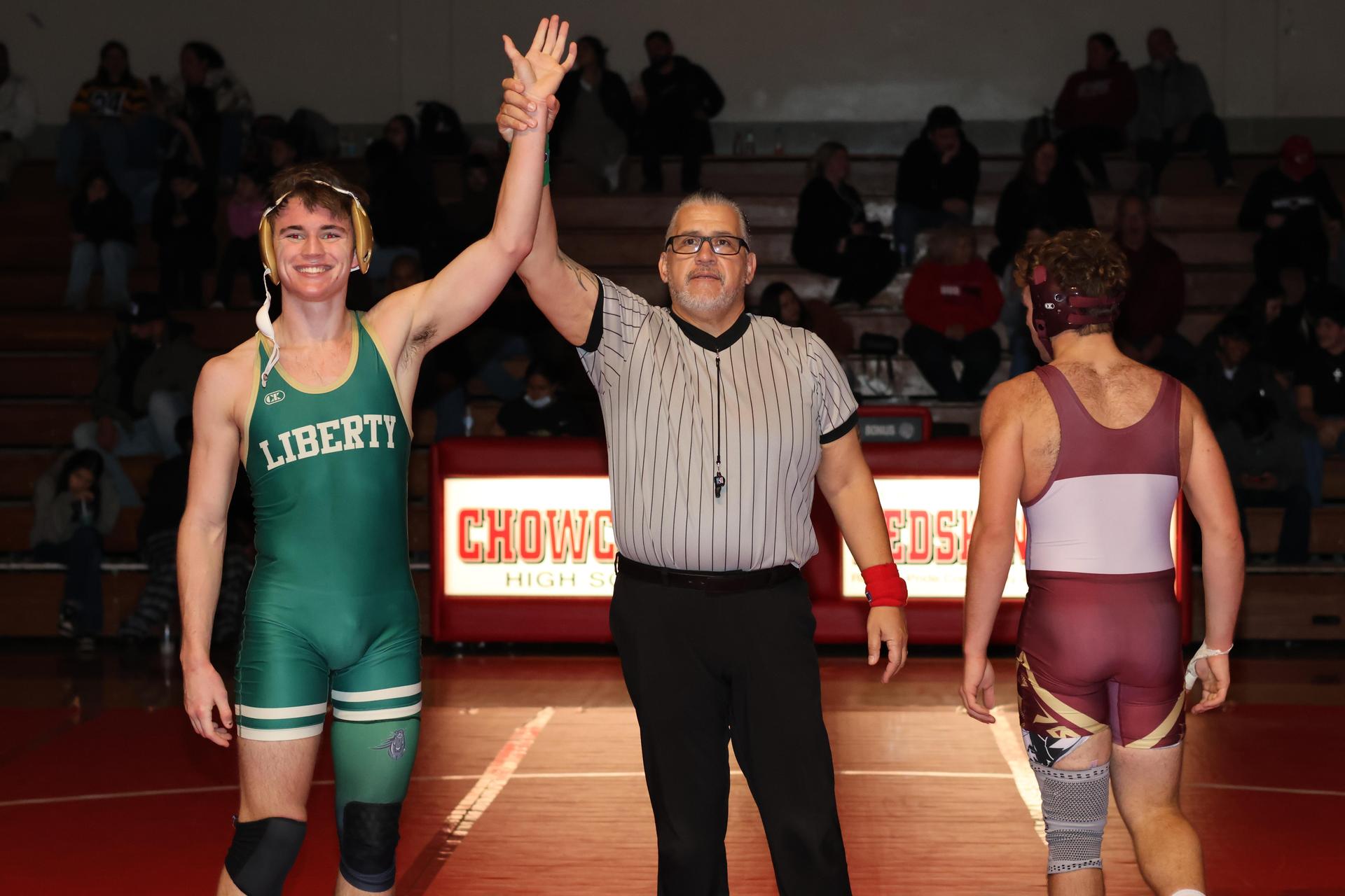 Wrestling winners with hands up 74