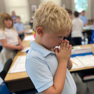 Photo of student praying