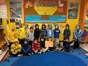 Kitah K poses for a picture in their raincoats