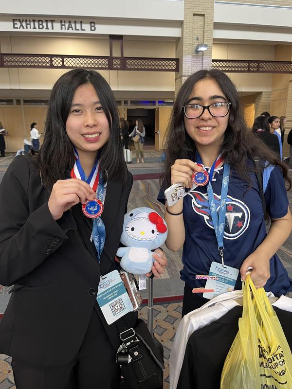 Smiling teens dressed in professional attire