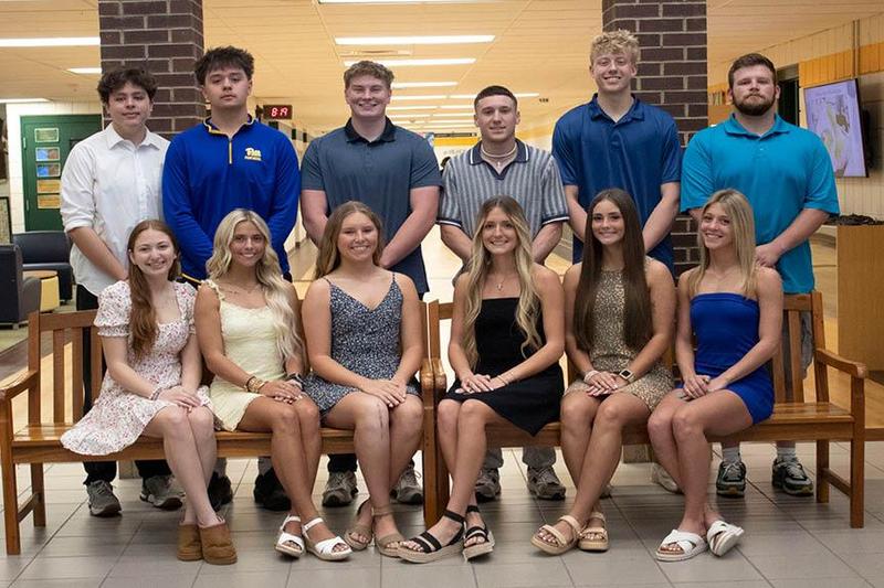 12 students, 6 boys and 6 girls, are gathered in the school lobby because they represent the prom court