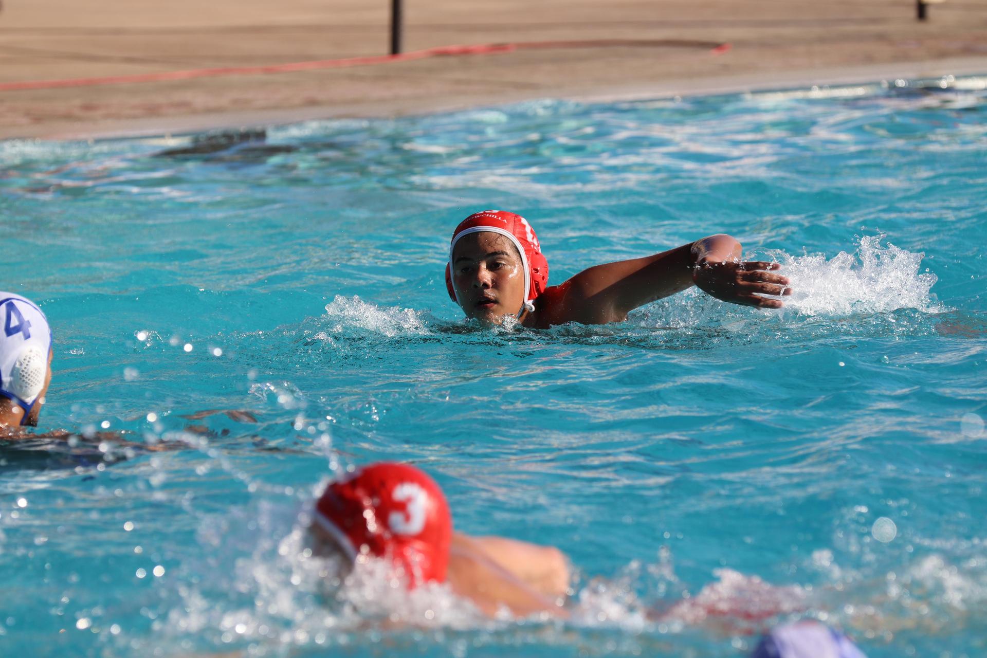 boys playing water polo against Madera
