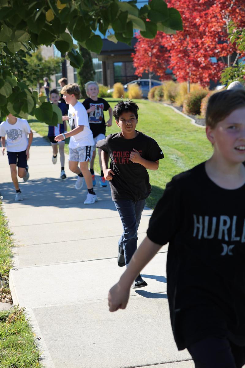Runners on a sidewalk