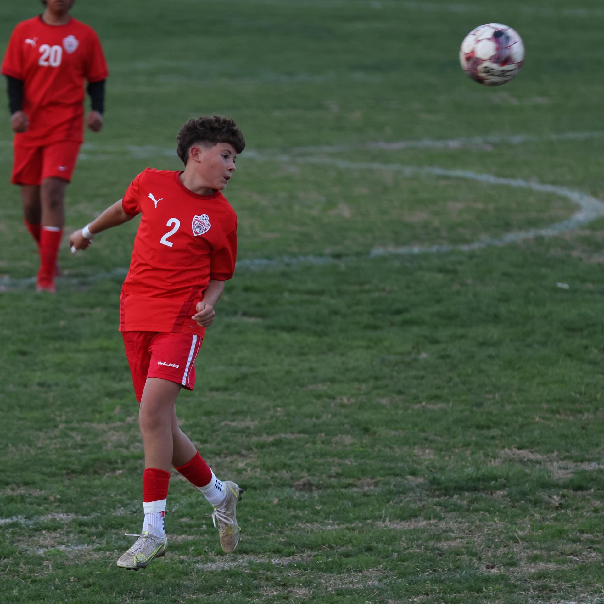 Junior Varisty boys playing soccer against Kingsburg