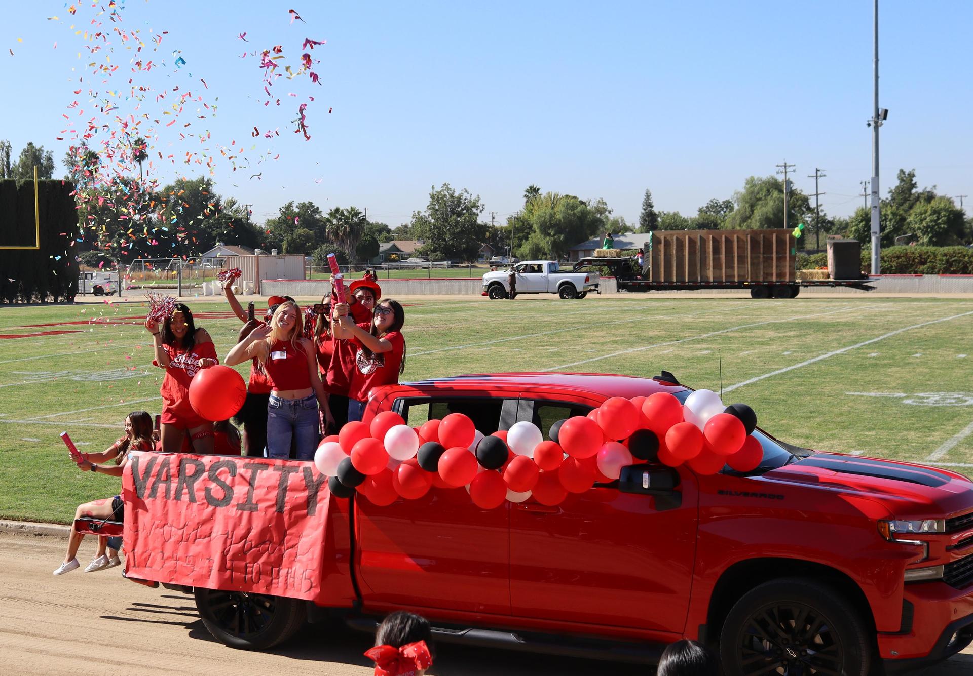 students and staff at the homecoming rally