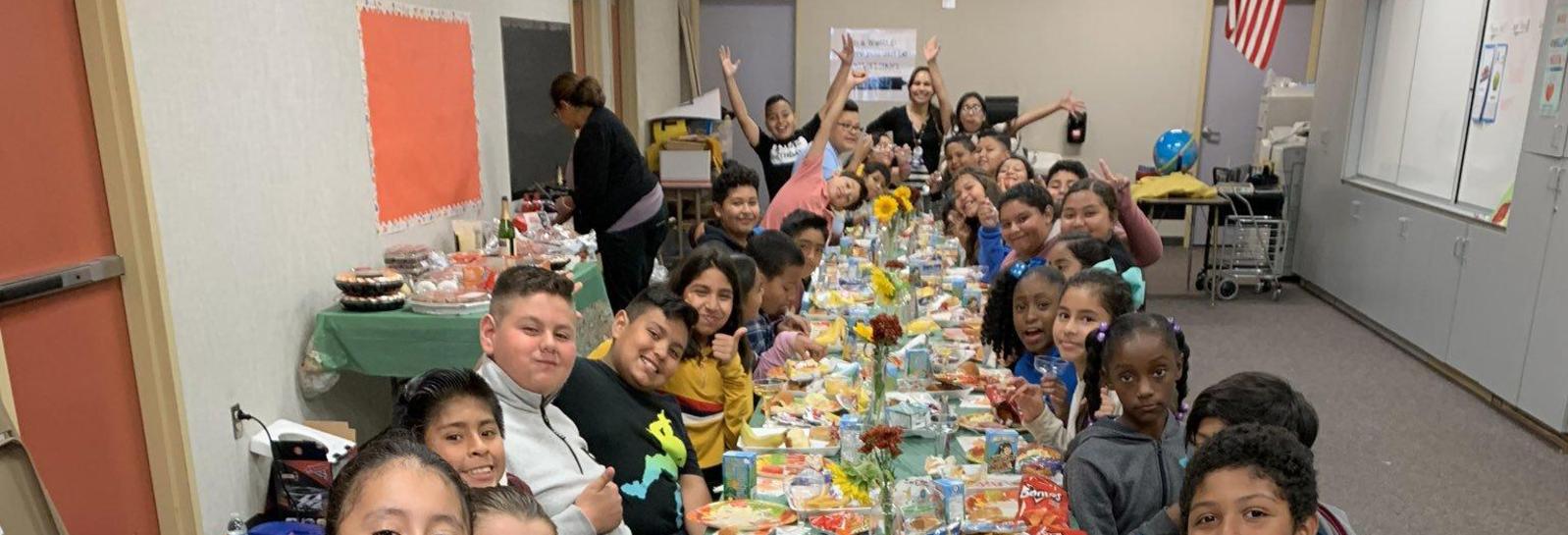 5th grade teacher Mrs. Caganap and her class enjoy a special Thanksgiving feast together!