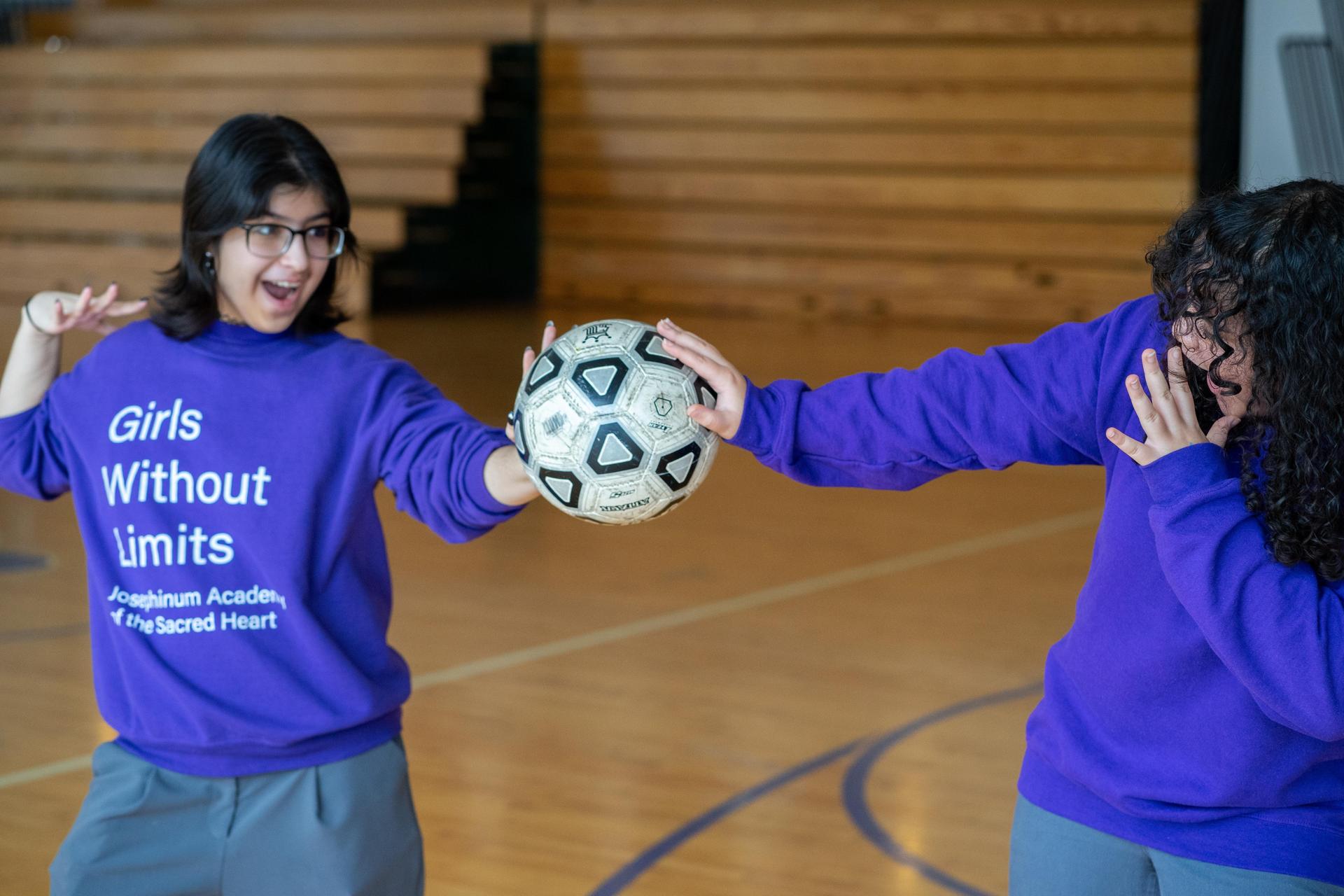 Students posing with volleyball