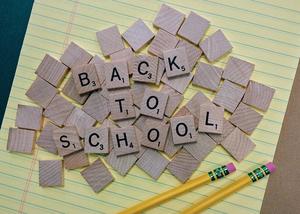 Scrabble letter tiles spell out Back to School