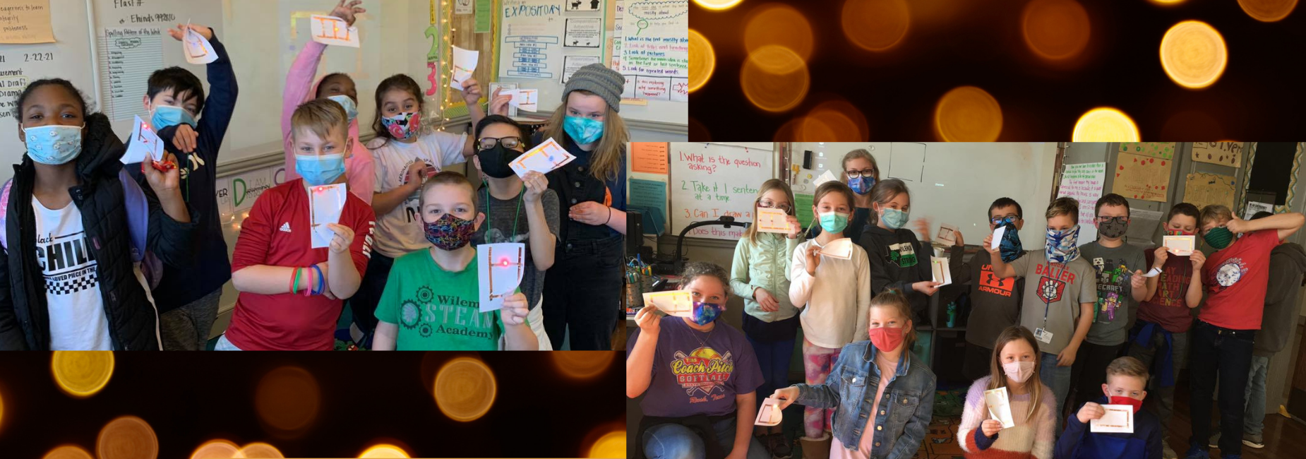 group of elementary students holding up notecards