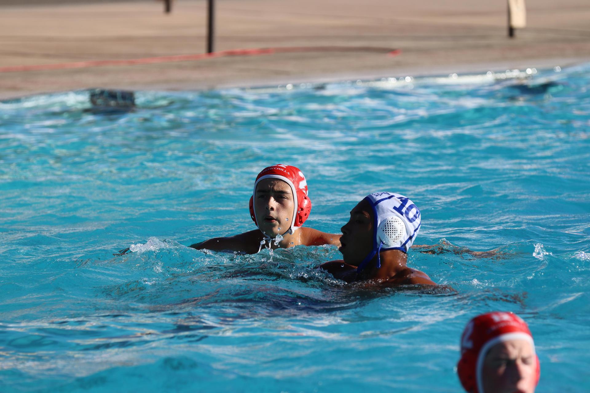 boys playing water polo against Madera