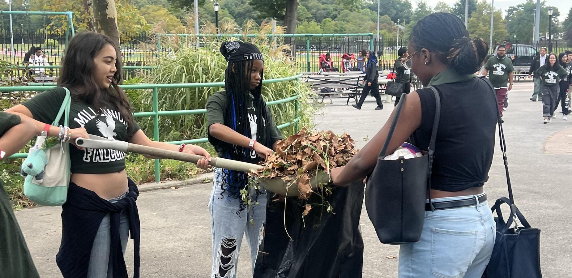 Students cleaning up Pelham Bay Park for community service day.