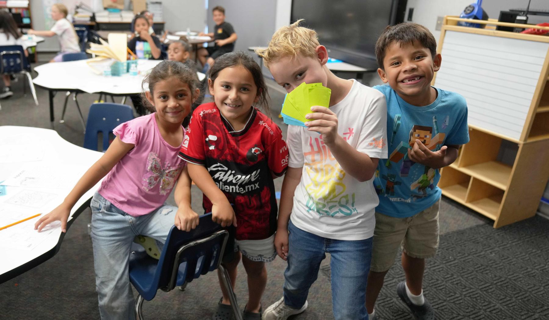 four smiling students