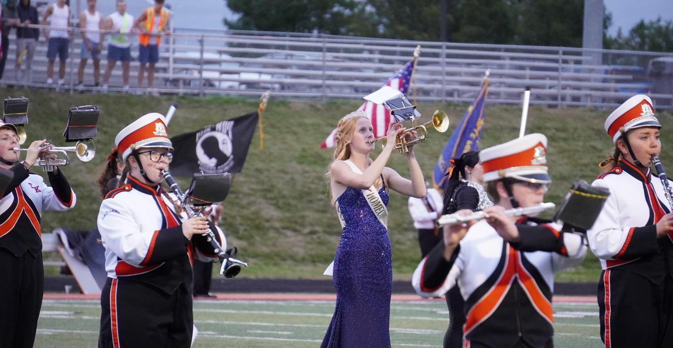 The TKHS band, including a member of the homecoming court, perform during the halftime of the game.