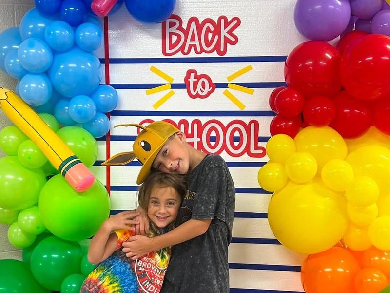 students pose at a back-to-school display at RES
