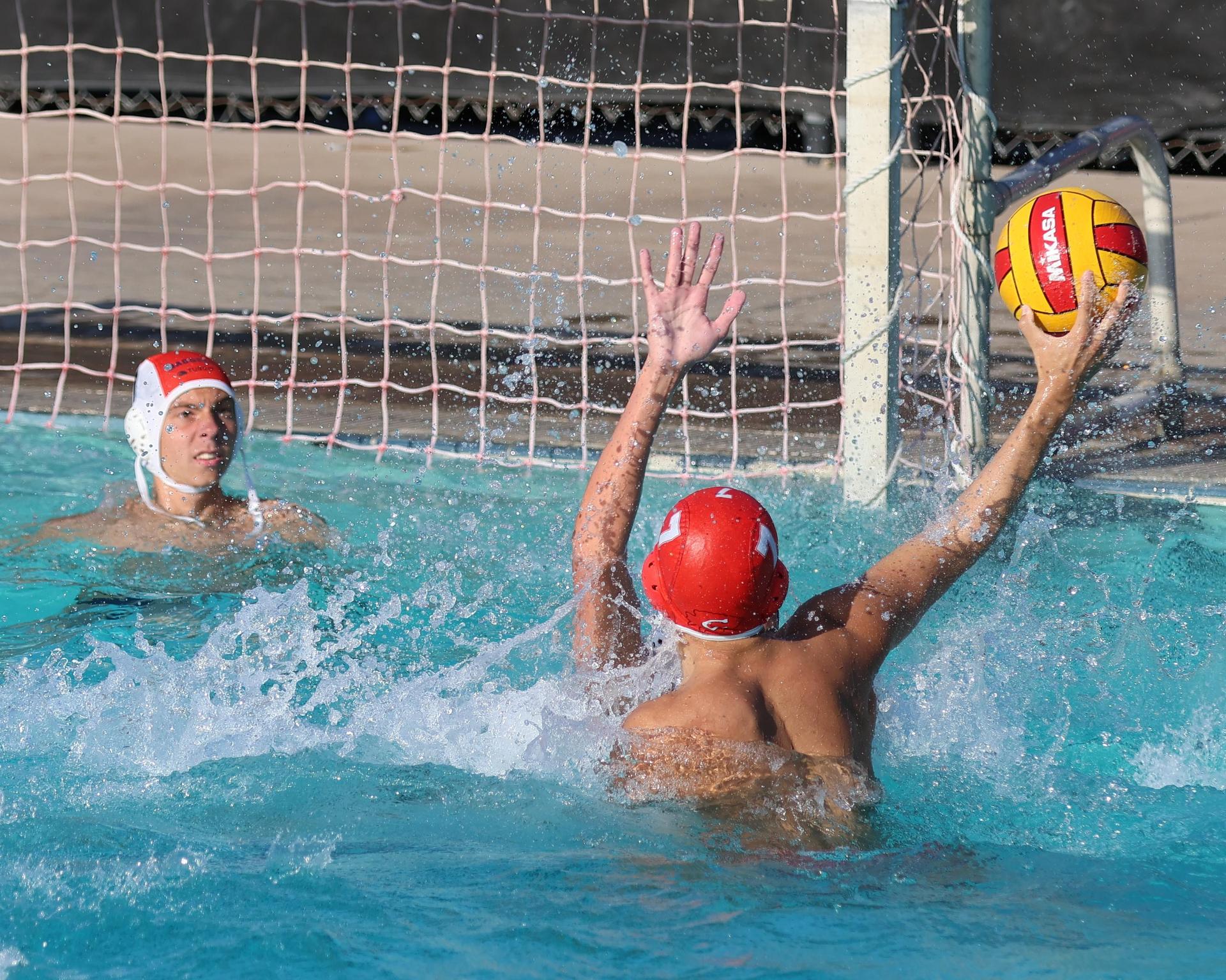 Boys playing water polo against Yosemite