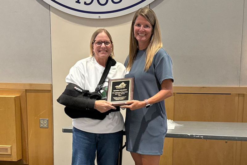 Mrs. Wanda Gilbert is joined by staff from VADETS with her honorary plaque.