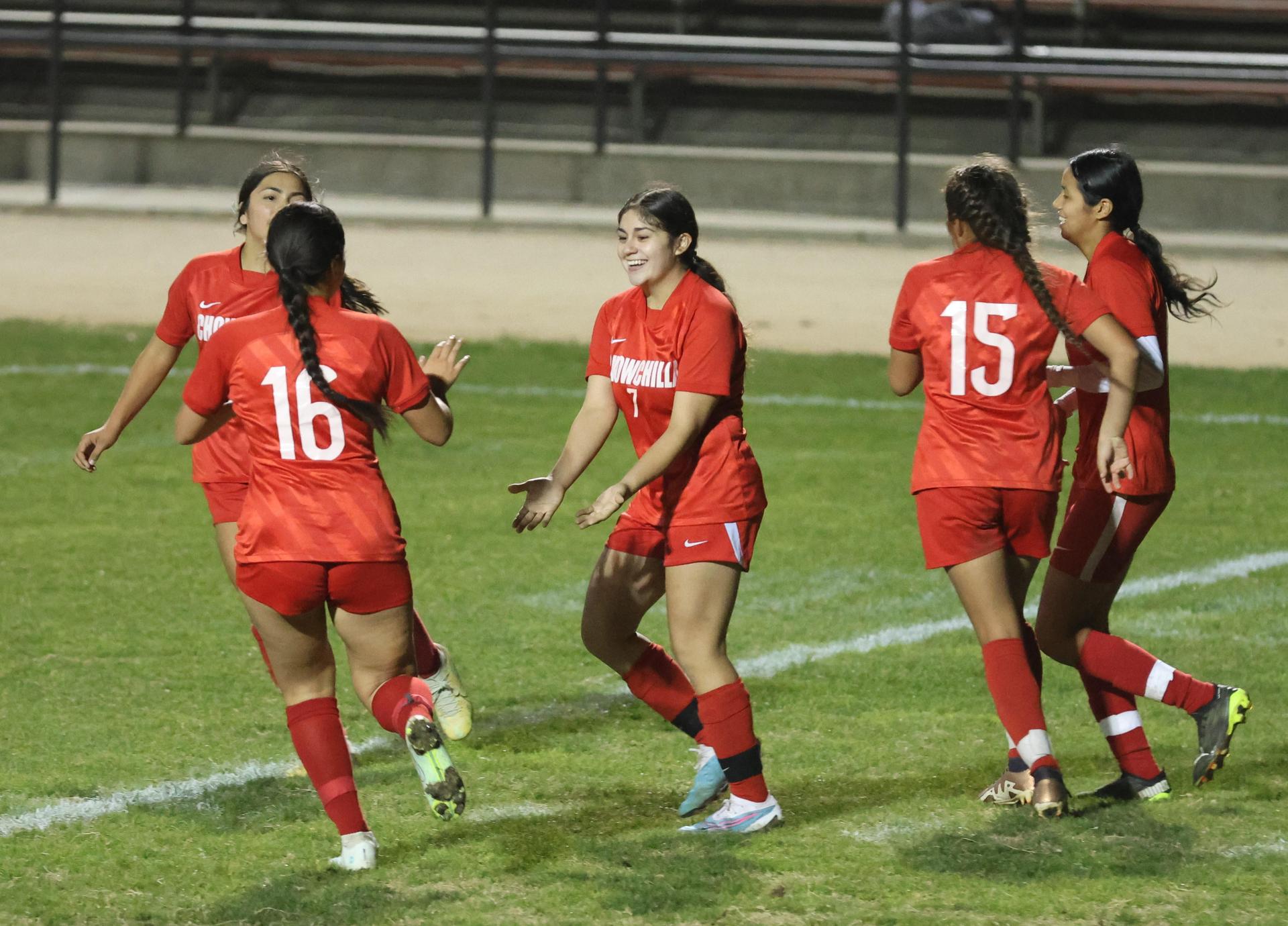 Varsity girls playing soccer against sunnyside