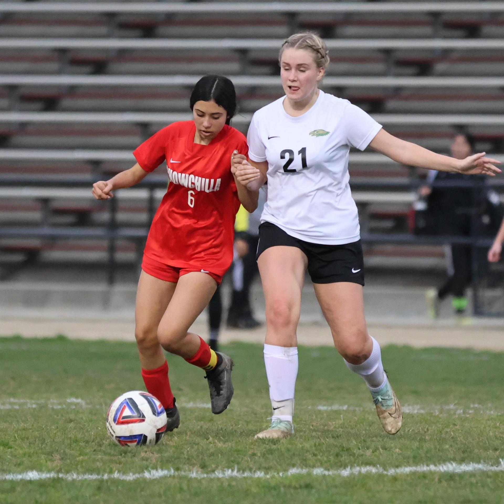 Junior varsity girls playing soccer against liberty