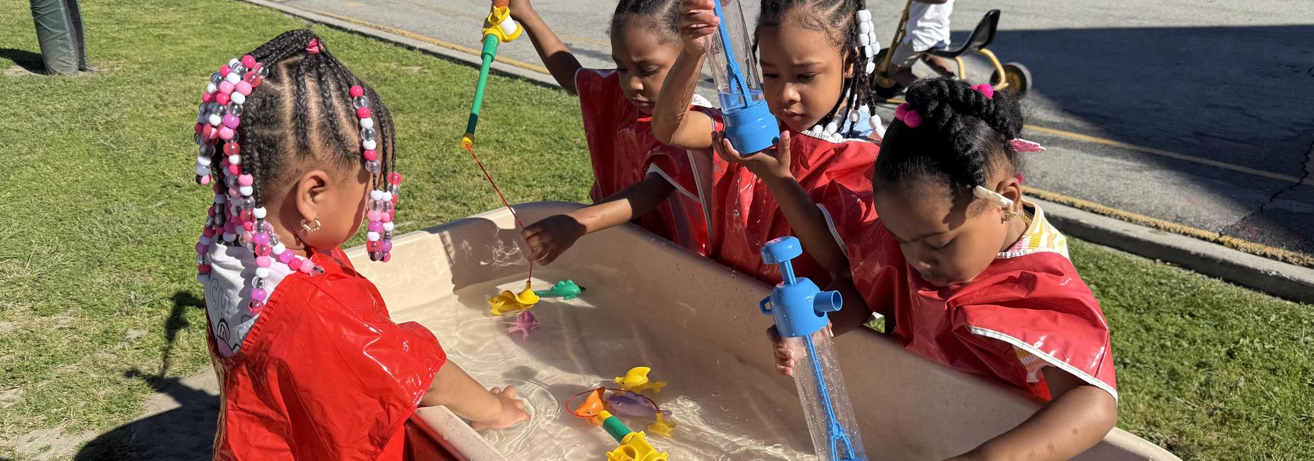 children playing in water table