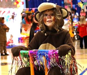 Student dressed as monkey riding bike