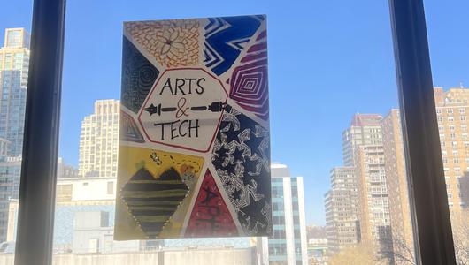 Colorful painting reading "Arts & Tech"