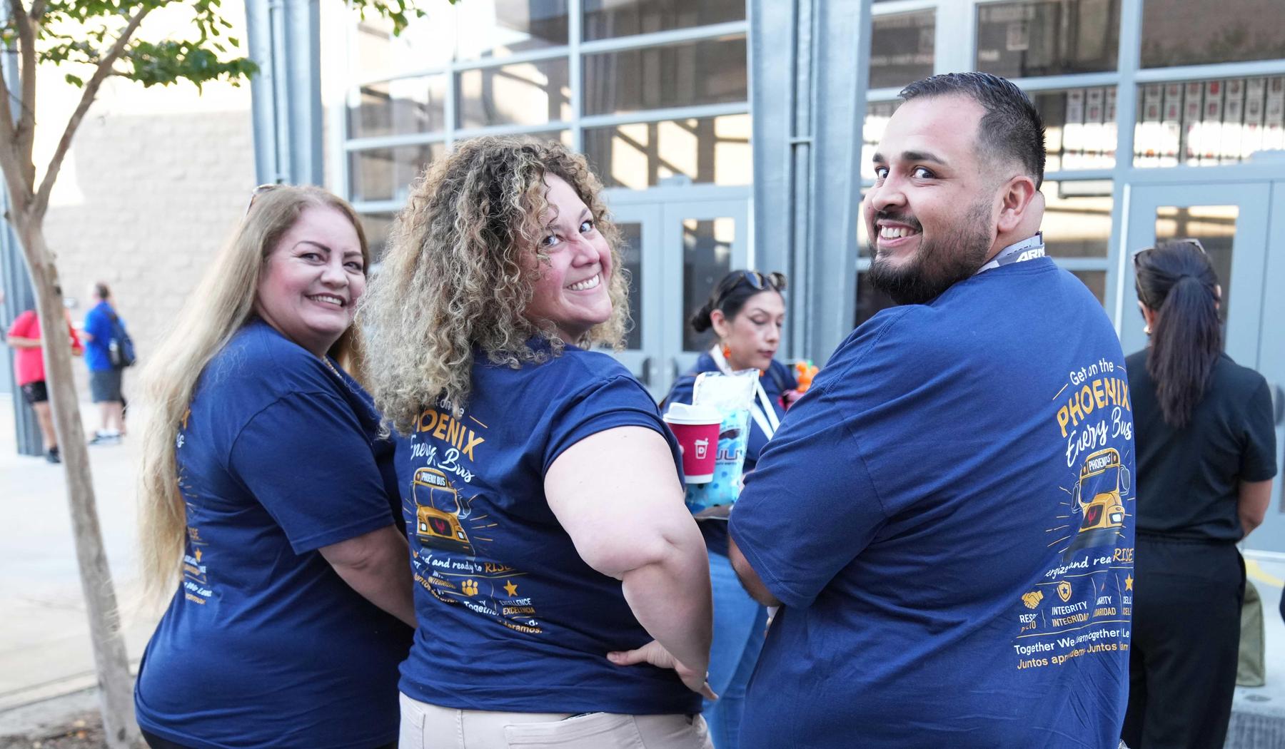 Hyatt staff showing their Energy Bus t-shirts