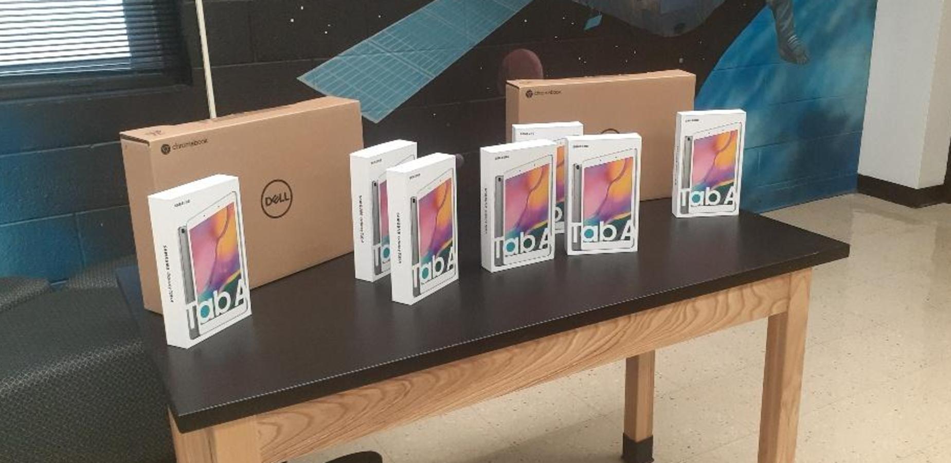 Students receiving electronic devices