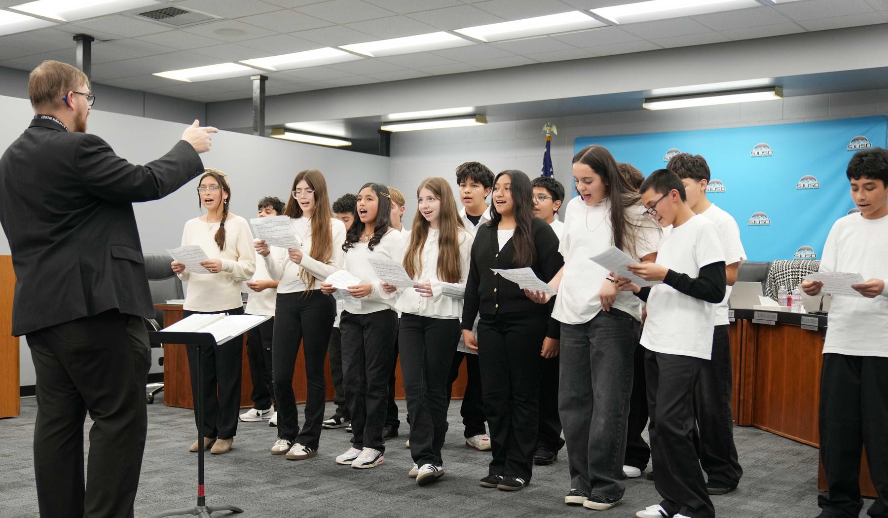 Hyatt World Language Academy 8th grade choir performing at the February Board meeting