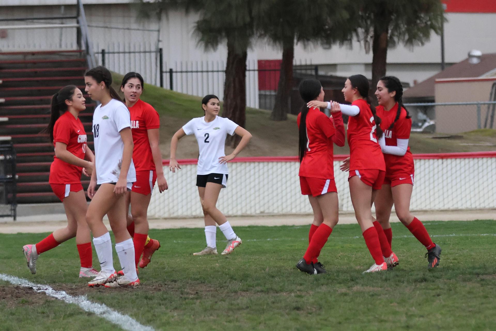 Junior varsity girls playing soccer against liberty