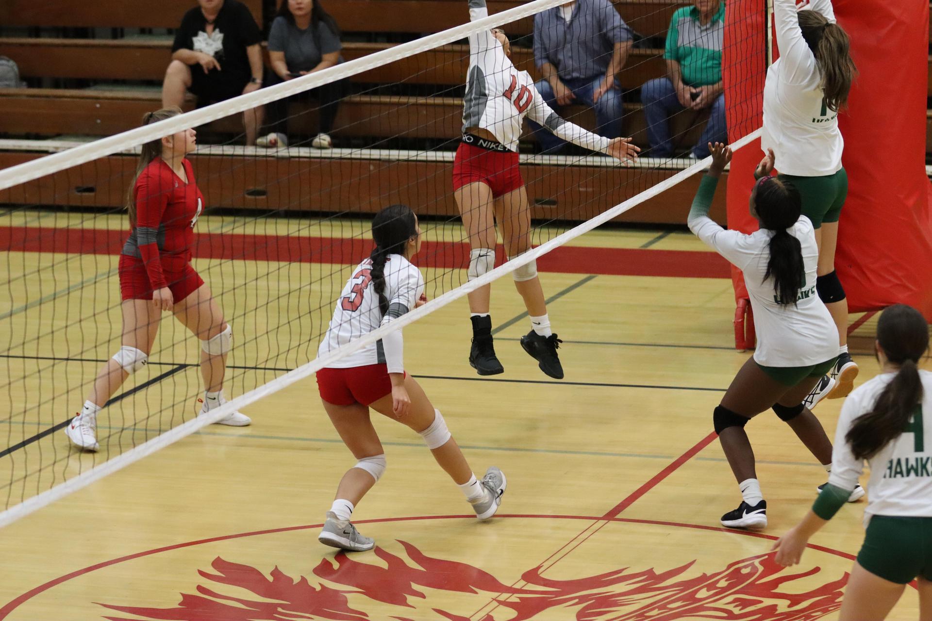 junior varsity girls playing volleyball against Liberty