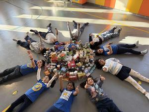 group of students with the collected food items