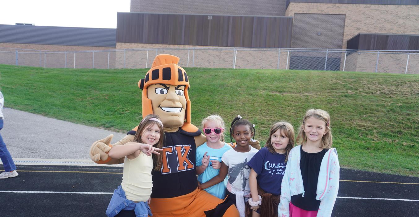 Students pose with Tommy Trojan during the walk-a-thon event.